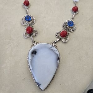 Elegant Silver Necklace with Red and Blue Accents